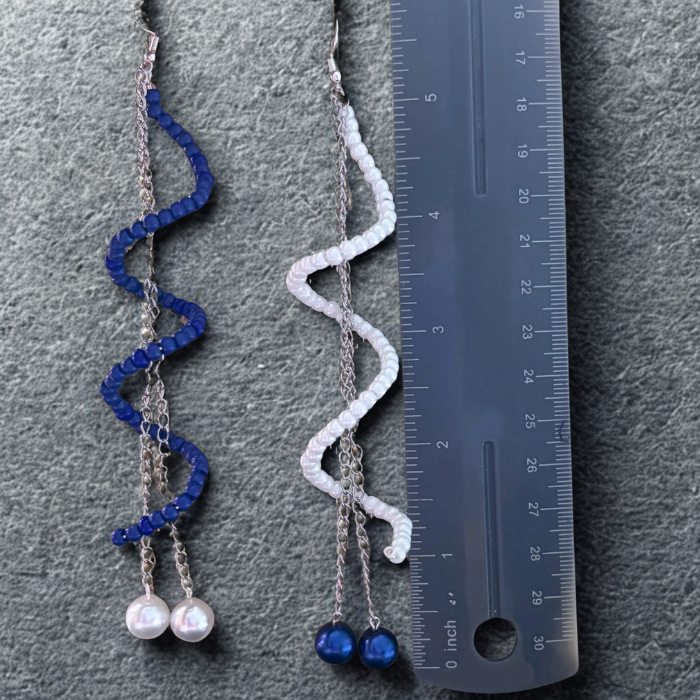 Twisted Blue or White Drop Earrings by Peace N Beads Design displayed next to a ruler for size reference