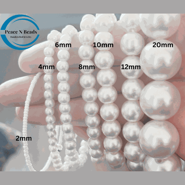 Royal Blue Jade and White Pearl Bracelet with Dove Charm with varying bead sizes from Peace N Beads.