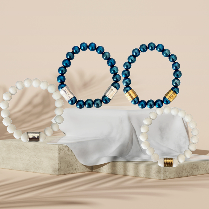 Blue Hematite and White Jade Double Bracelets by Peace N Beads Design displayed on stone and fabric backdrop