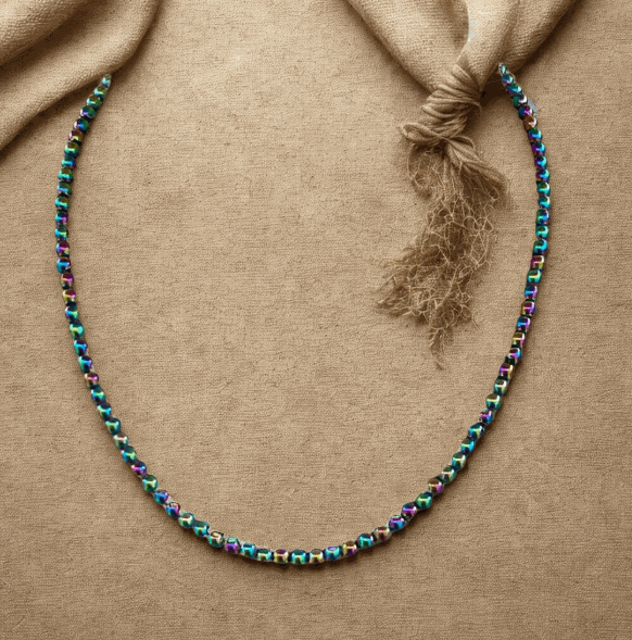 Bohemian Dream Handmade Rainbow Hematite Necklace with multicolored shimmering beads on a textured background