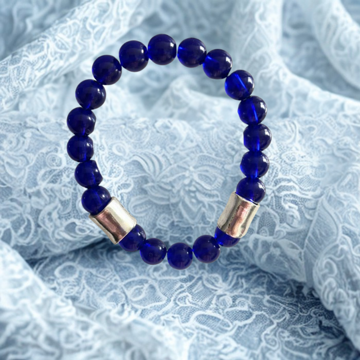 Elegant White and Blue Jade Gemstone Bracelet Set with smooth beads and gold accents on soft fabric background