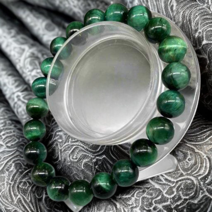 Genuine Green Tiger Eye Motivational Bracelet by Peace N Beads with polished green beads on fabric background