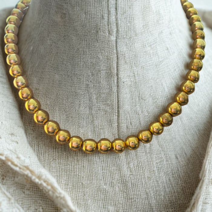 Gold Hematite Gemstone Necklace by Peace N Beads Design with polished round beads on a fabric display
