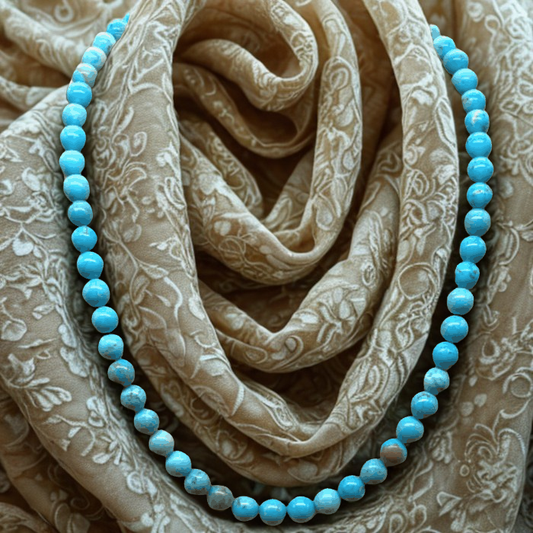 Invigorating Turquoise Beaded Necklace Embrace Harmony by Peace N Beads on patterned fabric background