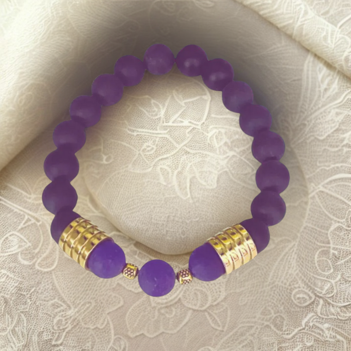 Luxurious Matted Purple Jade Bracelet with Gold Accents on a Soft Fabric Background