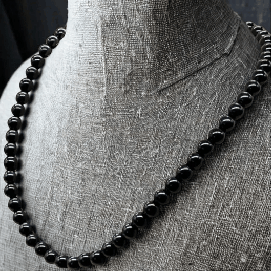 Peace N Beads Black Onyx Gemstone Necklace featuring smooth round black beads on display