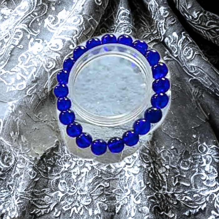 Blue Jade Friendship Bracelet featuring vibrant blue beads on a silver background