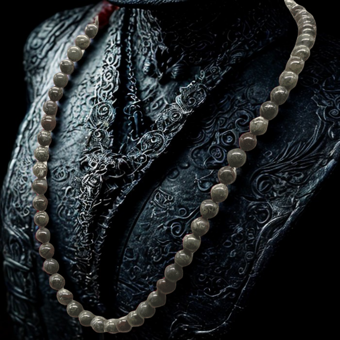 Dragon Blood Gemstone Necklace with round beads displayed on black embossed background by Peace N Beads