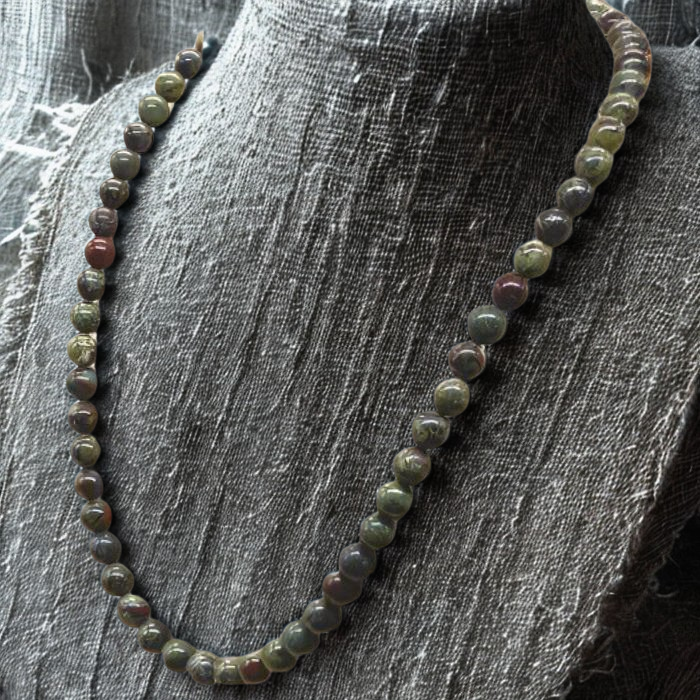 Dragon Blood Gemstone Necklace featuring vibrant round beads in earthy colors and elegant design