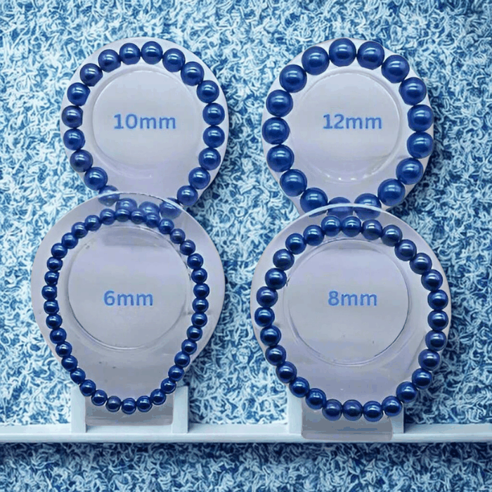 Elegant Single Strand Royal Blue Glass Pearl Stretch Bracelet in 6mm 8mm 10mm and 12mm bead sizes displayed on stands