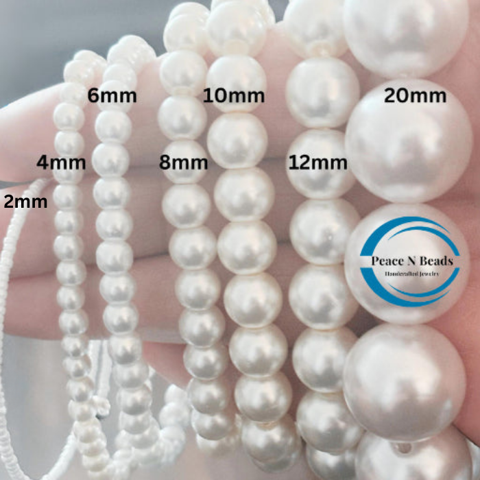 Evergreen Wrap Bracelet featuring various sizes of elegant white pearls for stylish layering