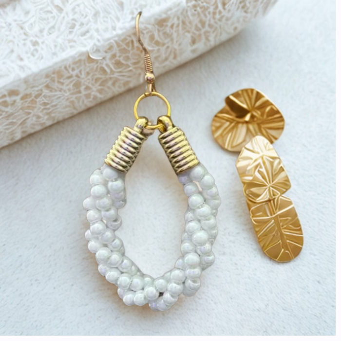 Gold Accented Twisted Royal Blue and Gold Hoop Earrings by Peace N Beads displayed on a soft surface