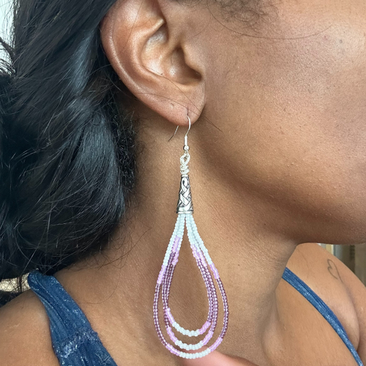 Lavender, Pink and White Seed Bead Drop Earrings showcasing a stylish design elegantly worn by a model