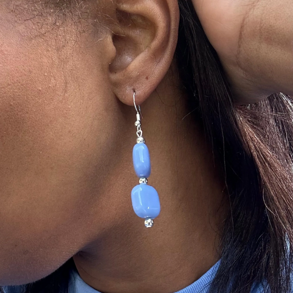 Light Blue and White Drop Earrings by Peace N Beads worn on ear showing smooth blue bead design