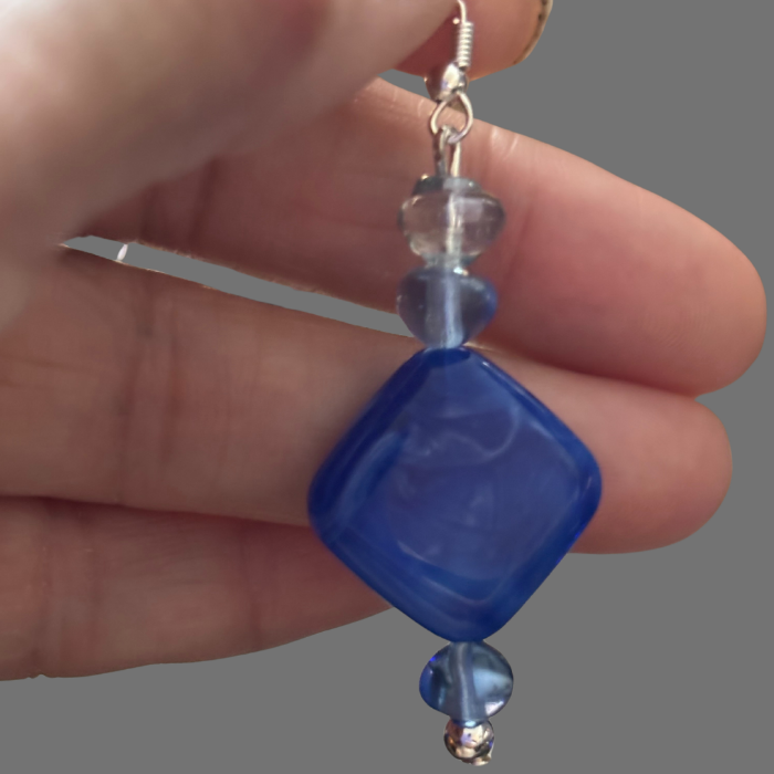 Peace N Beads Design Royal Blue Drop Earrings with geometric blue beads held by hand