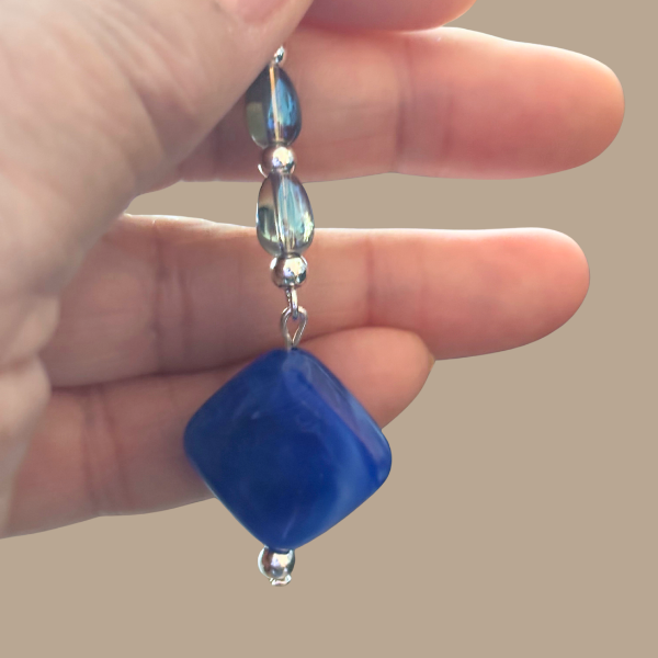 Sophisticated Rectangle Drop Earrings in Royal Blue. Handheld blue rectangle bead earring with silver accents and faceted beads