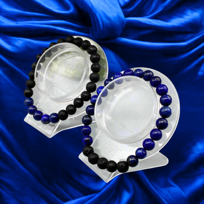 Two Third Eye Chakra Bracelets featuring black lava stones and blue lapis lazuli on a display stand