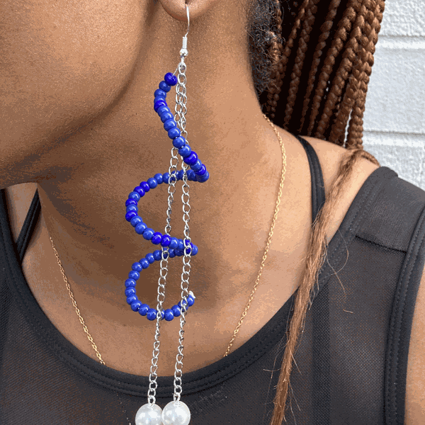 Twisted Blue or White Drop Earrings by Peace N Beads Design worn on ear showcasing blue beads and silver chains