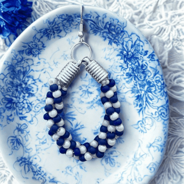 Twisted Royal Blue and White Hoop Earrings by Peace N Beads with beaded design and silver hooks