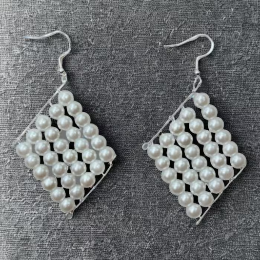 Peace N Beads White Glass Pearl Retanglar Earrings with silver hooks on gray fabric background