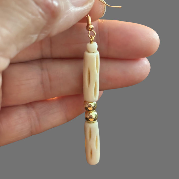 Wood and Hematite Drop Earrings by Peace N Beads Design held in hand with carved wood and metallic beads