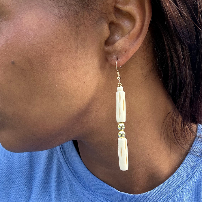 Wood and Hematite Drop Earrings by Peace N Beads Design worn on a person with a blue shirt