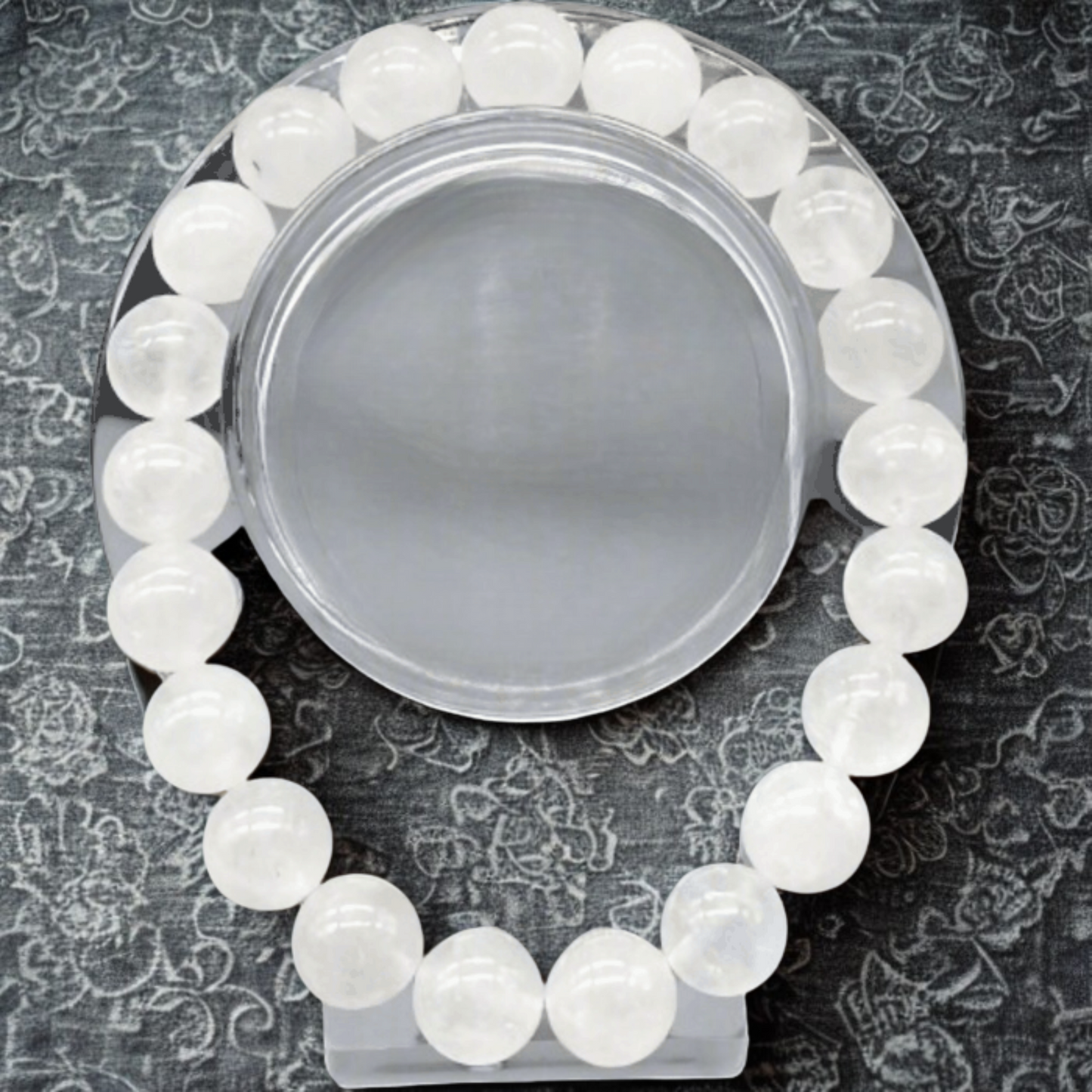 Premium White Jade Gemstone Bracelet by Peace N Beads with smooth round white beads on a black patterned background