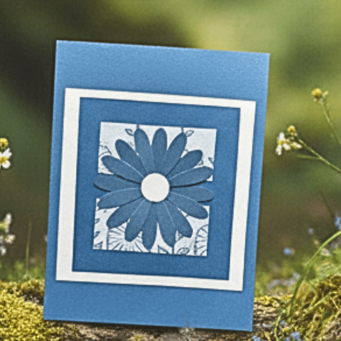 Handmade note card featuring a blue flower design, perfect for notes about Puppies in the Sunshine