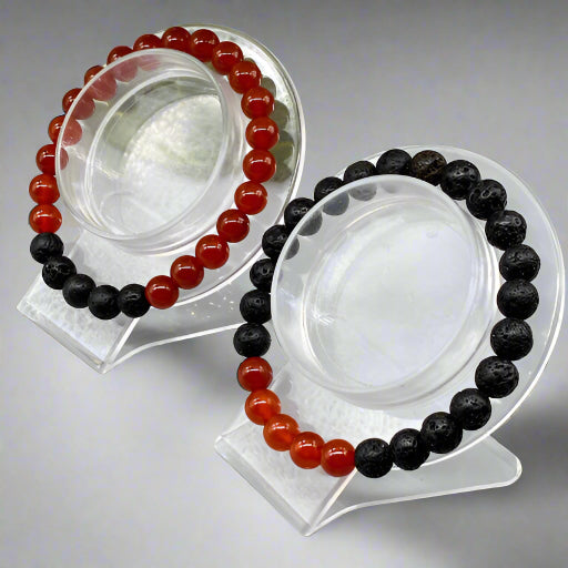 Peace N Beads Design Sacral Plexus Chakra Bracelets with red and black beads on clear display stands
