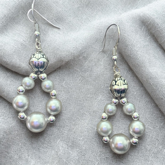 Peace N Beads Small White Pearl Drop Earrings with silver accents on gray fabric background