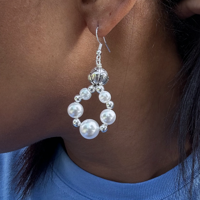 Peace N Beads small white pearl drop earrings worn on ear with silver detailing