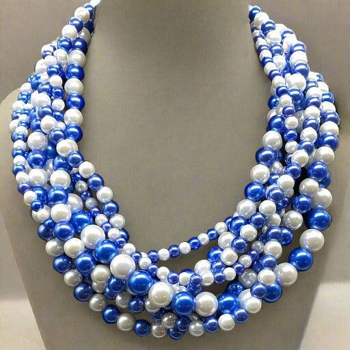 Royal Blue and White Glass Pearl 7 Strand Necklace with layered design on display.