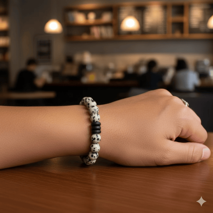 Dalmatian Gemstone Bracelet on wrist showcasing unique spotted beads in a stylish setting