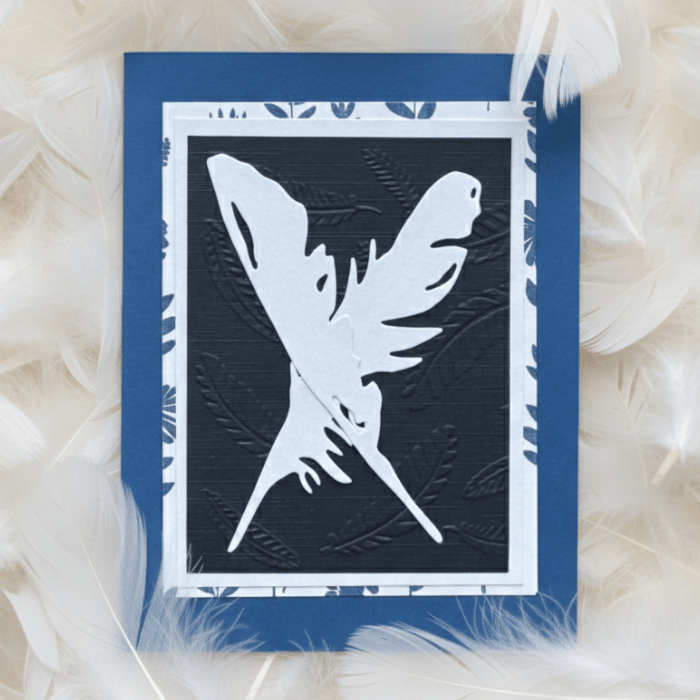 A Flutter of Fun note cards featuring a white feather design on a blue background