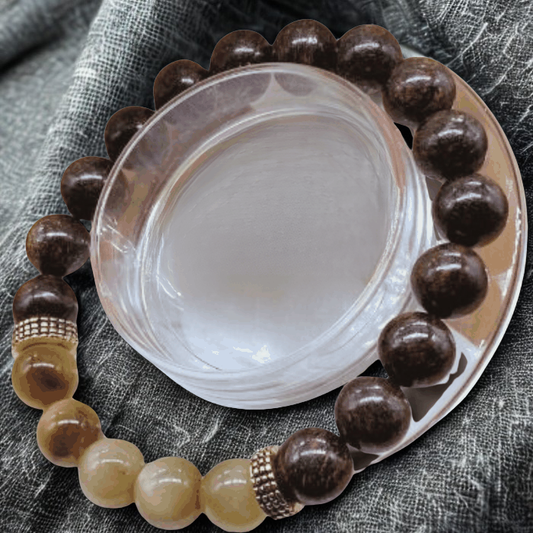 Bronzite Brown and Golden Tiger Eye Gemstone Bracelet on a textured background