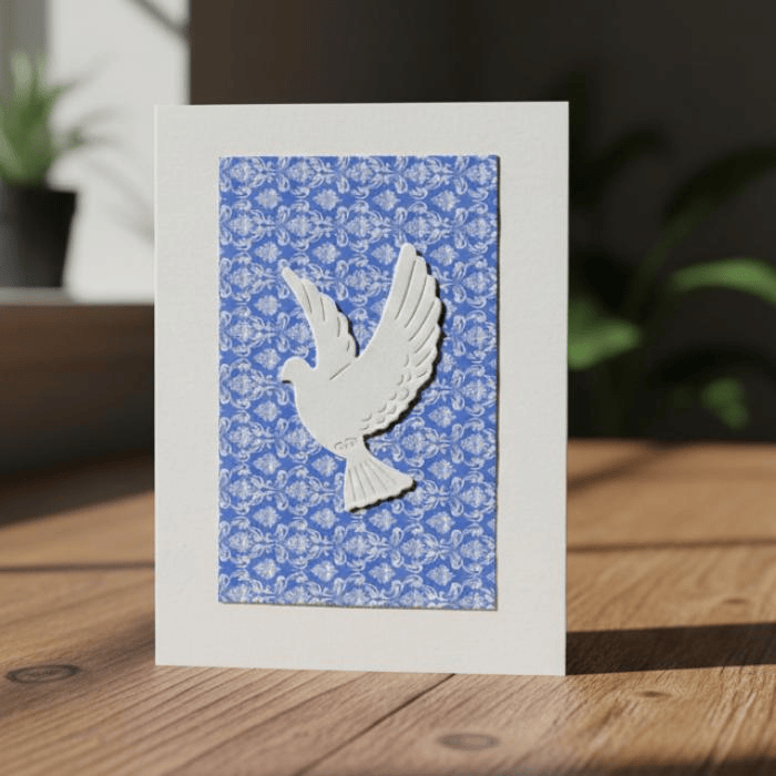 Doves in Flight Note Card Set featuring a white dove design on a blue patterned background
