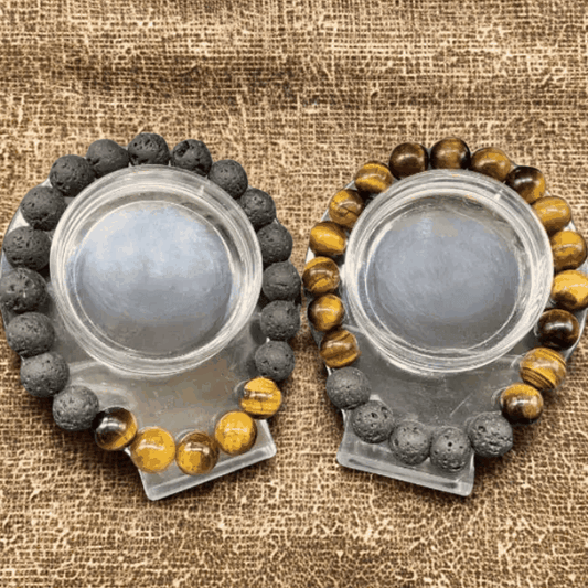 Earthly Elegance Tiger Eye Bracelet Natural Beauty displayed on a clear stand with lava stone accents