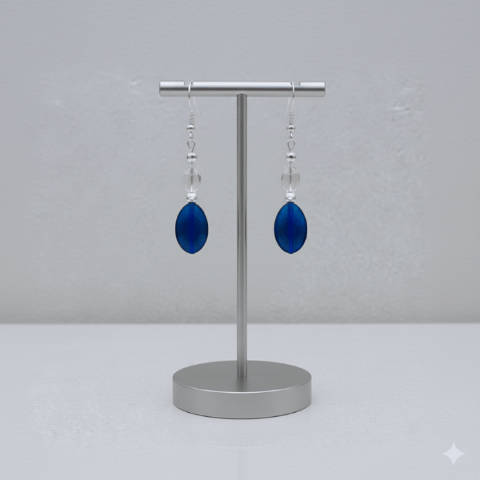 Elegant Blue Acrylic Earrings with Glass Crystals displayed on a silver stand