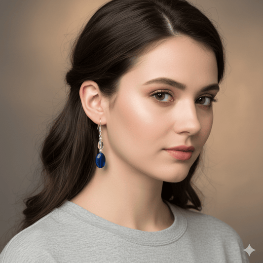 Elegant Blue Acrylic Earrings with Glass Crystals showcased on a model wearing a gray shirt