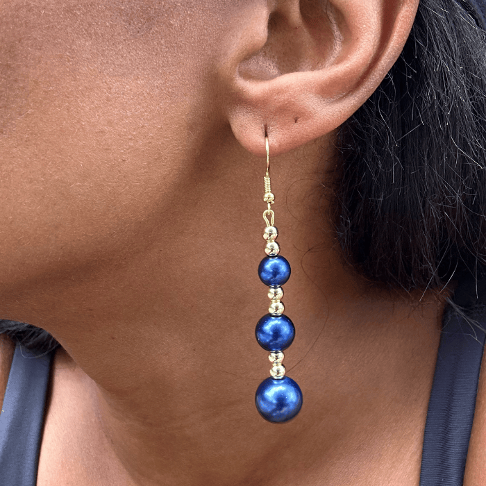 Elegant Hematite and Blue Glass Pearl Drop Earrings showcased on a model's ear