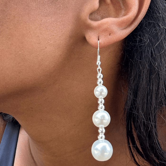 Elegant Hematite and Glass Pearl Drop Earrings showcased on a model's ear with a close-up view