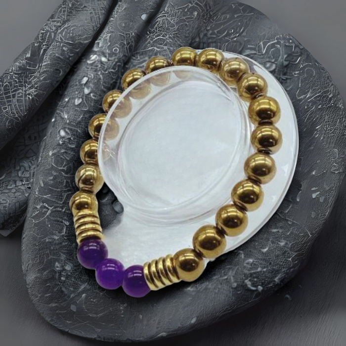 Exquisite Beaded Bracelet with Purple Jade and Gold Hematite displayed on a textured background