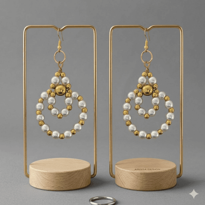 Stylish Handmade Pearl and Hematite Earrings with gold accents displayed elegantly