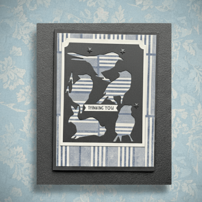 Ink Winged Whispers note cards featuring a stylish bird design with a blue striped background