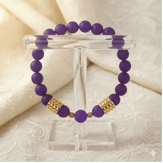 Luxurious Matted Purple Jade Bracelet with Gold Accent Beads on a Display Stand