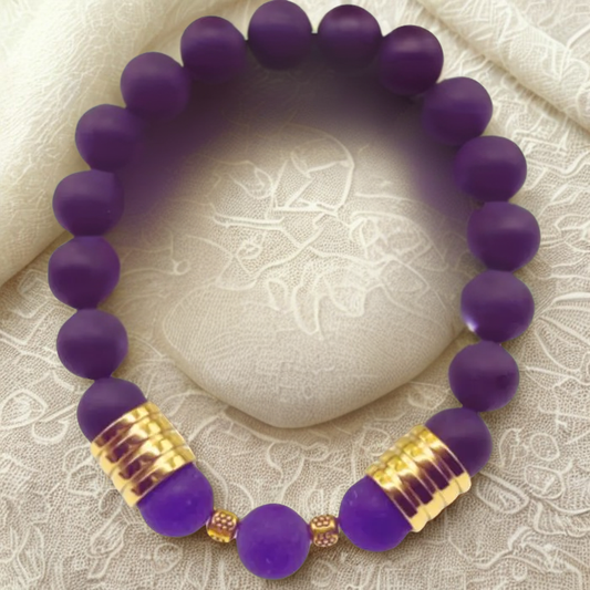 Luxurious Matted Purple Jade Bracelet with gold accents on a soft fabric background
