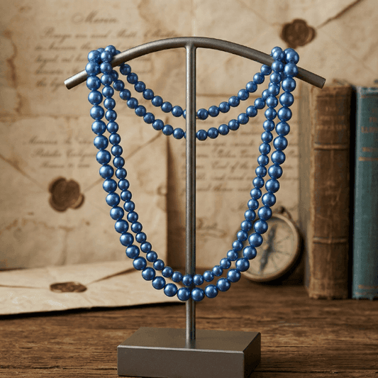2 Strand Blue Pearl Necklace displayed on a metal stand, showcasing its elegant design and luster