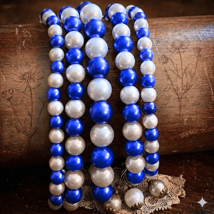 5 Strand Royal Blue and White Pearl Bracelet, featuring alternating blue and pearl beads for a stylish look