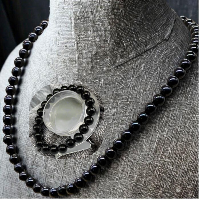 Black Onyx Jewelry Set featuring a necklace and matching bracelet on a display mannequin
