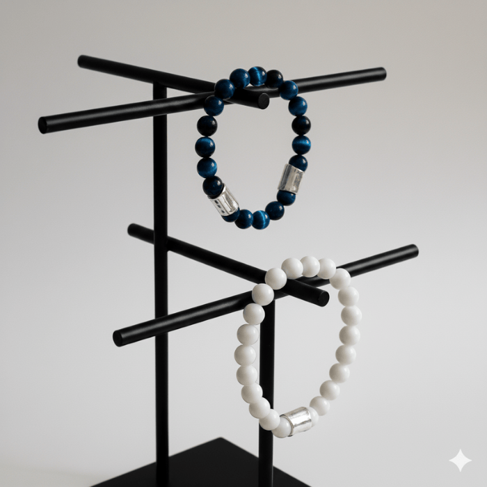 Blue Tiger Eye and Jade Gemstone Bracelets displayed on a sleek black stand for elegant styling